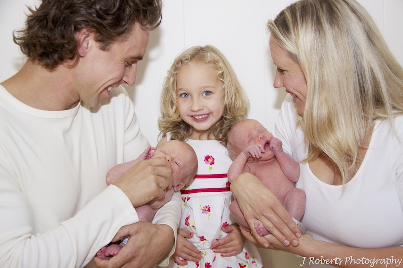 Family smiling a newborn baby twins - newborn baby twin portrait photography sydney